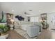 Inviting living room with plush seating, stylish decor, and plenty of natural light, creating a relaxing atmosphere at 7530 Whitcomb St, Englewood, FL 34223