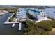 Stunning waterfront condos with docks, palm trees, and manicured landscaping at 8005 Bay Pointe Dr, Englewood, FL 34224