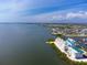 Waterfront condo complex showcasing stunning views and lush landscaping on the water at 8005 Bay Pointe Dr, Englewood, FL 34224