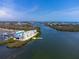 Aerial view of waterfront condo highlighted with an arrow showing the specific unit for sale at 8005 Bay Pointe Dr, Englewood, FL 34224