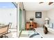 Open glass sliding doors from the living room leads to the waterfront balcony at 8005 Bay Pointe Dr, Englewood, FL 34224