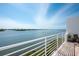 Breathtaking water view from a private balcony with seating, enhancing the condo living experience at 8005 Bay Pointe Dr, Englewood, FL 34224