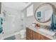 Bright bathroom boasts a spacious glass enclosed shower, and granite counters at 8005 Bay Pointe Dr, Englewood, FL 34224