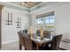 Dining area with views of the water, wine racks, and modern lighting at 8005 Bay Pointe Dr, Englewood, FL 34224