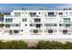 Modern condos with balconies overlooking the water, providing direct access to beautiful scenery at 8005 Bay Pointe Dr, Englewood, FL 34224