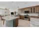 Bright open kitchen with a spacious island, modern appliances, and eat-in dining area at 8005 Bay Pointe Dr, Englewood, FL 34224