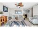 Relaxing living room complete with ceiling fan, sofa, desk, and wet bar at 8005 Bay Pointe Dr, Englewood, FL 34224