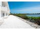Picturesque waterfront walkway with white rock and stunning water views at 8005 Bay Pointe Dr, Englewood, FL 34224