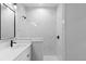 Contemporary bathroom showcasing marble tile walls, a walk-in shower, and sleek black fixtures at 8105 Antwerp Cir, Port Charlotte, FL 33981