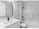 Stylish bathroom featuring a modern vanity with a sleek black faucet and a beautifully tiled shower and tub at 8105 Antwerp Cir, Port Charlotte, FL 33981