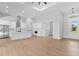 Bright, open-concept kitchen with white cabinetry, stainless steel appliances, and a large island, perfect for entertaining at 8105 Antwerp Cir, Port Charlotte, FL 33981