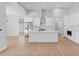 Bright, modern kitchen with stainless steel appliances and a large center island at 8105 Antwerp Cir, Port Charlotte, FL 33981