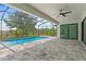Relaxing screened-in pool and patio area with brick flooring and ample space at 8105 Antwerp Cir, Port Charlotte, FL 33981