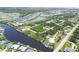 Stunning aerial view of a waterfront community, with homes lining canals and picturesque waterways at 8127 Consul St, Port Charlotte, FL 33981