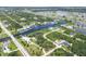 Panoramic aerial view of a waterfront property surrounded by interconnected waterways and lush landscapes at 8127 Consul St, Port Charlotte, FL 33981