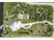 Aerial view of a home with a private dock, pool, well-manicured landscaping, and a long driveway at 8127 Consul St, Port Charlotte, FL 33981