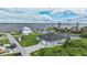 Gorgeous waterfront home boasts an attached two-car garage and a private dock on a sunny day at 8127 Consul St, Port Charlotte, FL 33981