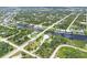 Breathtaking aerial view of a waterfront property near lush greenery and tranquil canals at 8127 Consul St, Port Charlotte, FL 33981
