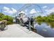 Modern boat lift with cover and twin engines, ready for waterfront living and easy access to the open water at 8127 Consul St, Port Charlotte, FL 33981