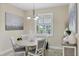 Bright dining area with a modern chandelier, and a decorative centerpiece for a cozy and elegant ambiance at 8127 Consul St, Port Charlotte, FL 33981