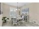 Cozy dining area with round table, stylish chairs, and natural light at 8127 Consul St, Port Charlotte, FL 33981