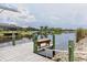 View from dock showing neighborhood waterfront properties along the canal at 8127 Consul St, Port Charlotte, FL 33981