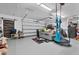 Spacious garage featuring ample storage, fitness equipment, and a comfortable seating area at 8127 Consul St, Port Charlotte, FL 33981