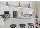 Modern kitchen boasts granite counters, stainless appliances, and stylish pendant lights at 8127 Consul St, Port Charlotte, FL 33981