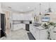 Spacious kitchen with granite countertops, stainless steel appliances, and white cabinetry at 8127 Consul St, Port Charlotte, FL 33981