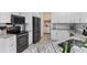 Well-equipped kitchen with granite counters, black appliances and white cabinetry at 8127 Consul St, Port Charlotte, FL 33981