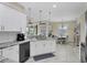Bright kitchen area with granite counters, white cabinets, and stainless steel appliances at 8127 Consul St, Port Charlotte, FL 33981