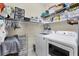Functional laundry room with a washer, dryer, shelving and storage options at 8127 Consul St, Port Charlotte, FL 33981