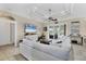 Bright living room features neutral tones, tile floors, and sliding glass doors at 8127 Consul St, Port Charlotte, FL 33981
