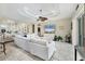 Spacious living room with a modern ceiling fan and tile flooring throughout at 8127 Consul St, Port Charlotte, FL 33981