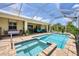 Relaxing screened pool and lanai area with spa provides outdoor enjoyment at 8127 Consul St, Port Charlotte, FL 33981