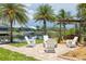 Picturesque waterfront scene with a fire pit and Adirondack chairs perfect for relaxing at 8127 Consul St, Port Charlotte, FL 33981