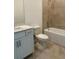 Bathroom with white vanity, toilet, and tiled shower/tub combo at 8360 Waterscape Rd, Englewood, FL 34224