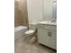 Bathroom with tile flooring, white vanity, toilet, and tub/shower combination at 8360 Waterscape Rd, Englewood, FL 34224