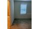 Bedroom featuring a window and tile flooring, with an ensuite bathroom viewable at 8360 Waterscape Rd, Englewood, FL 34224