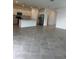 Modern kitchen with stainless steel appliances, white cabinetry and a center island at 8360 Waterscape Rd, Englewood, FL 34224