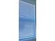 Close-up of a window with white blinds at 8360 Waterscape Rd, Englewood, FL 34224