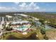 Overhead shot featuring community amenities, surrounding greenery, and scenic waterfront views at 8405 Placida Rd # 406, Placida, FL 33946