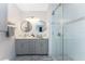 Beautiful primary bathroom with double sinks, vessel sinks, and glass-enclosed shower at 8405 Placida Rd # 406, Placida, FL 33946