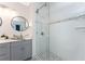 Bathroom featuring modern finishes like glass-enclosed shower, vessel sink, and grey vanity at 8405 Placida Rd # 406, Placida, FL 33946