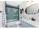 Beautiful bathroom featuring stylish blue tile in the shower and new sink at 8405 Placida Rd # 406, Placida, FL 33946