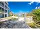Gated community with landscaping and water fountain under a bright blue sky at 8405 Placida Rd # 406, Placida, FL 33946
