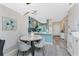 Dining area near a modern kitchen featuring stainless appliances and attractive backsplash at 8405 Placida Rd # 406, Placida, FL 33946