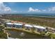 Beautiful condo complex with lovely landscaping, fountain, and scenic water views at 8405 Placida Rd # 406, Placida, FL 33946