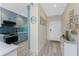 Modern condo kitchen with stainless steel appliances, blue cabinets, and backsplash at 8405 Placida Rd # 406, Placida, FL 33946