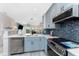 Beautiful kitchen with stainless steel appliances, attractive backsplash, and sleek countertops at 8405 Placida Rd # 406, Placida, FL 33946